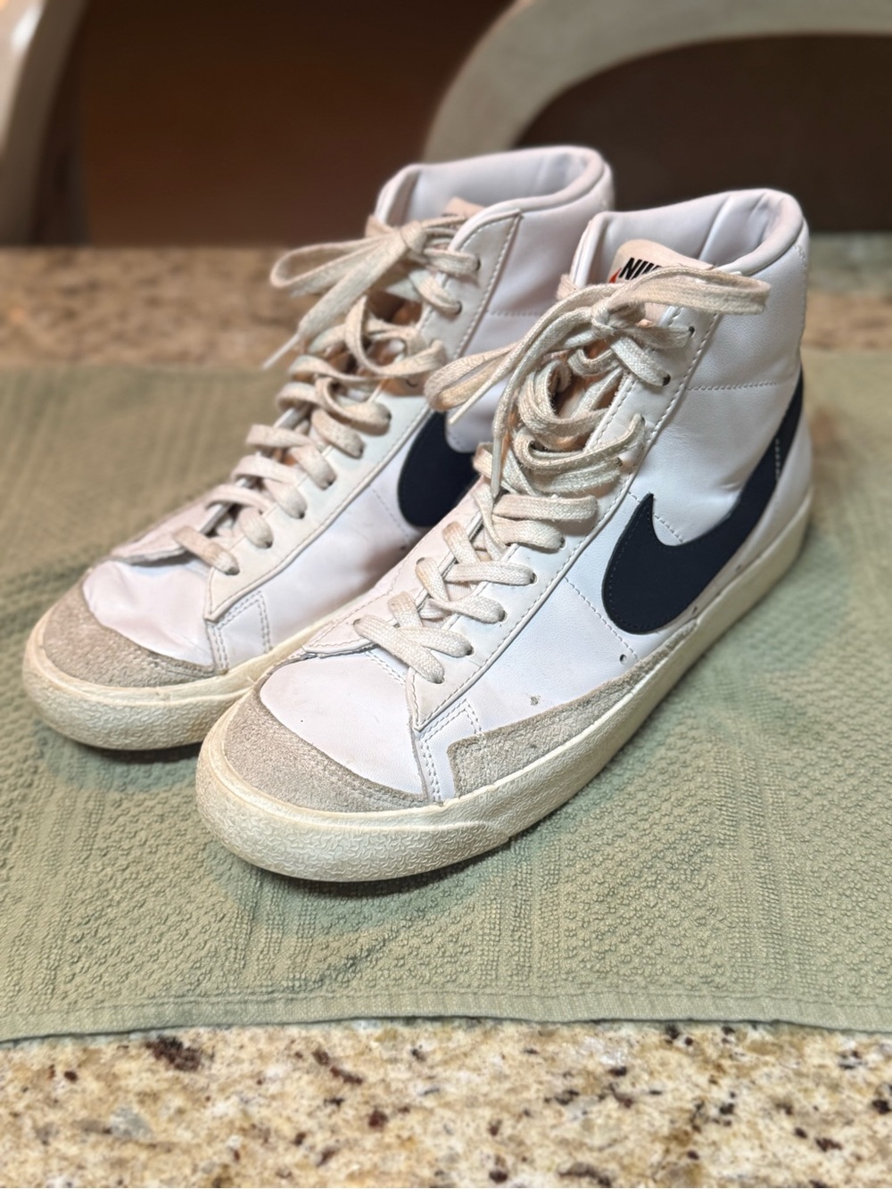 Nike High-Top Sneakers in White with Black Swoosh